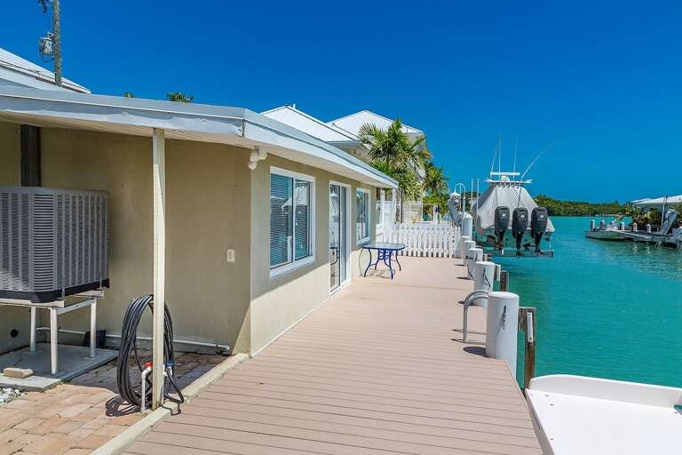 Huge 55` dock directly accessed through the backyard.